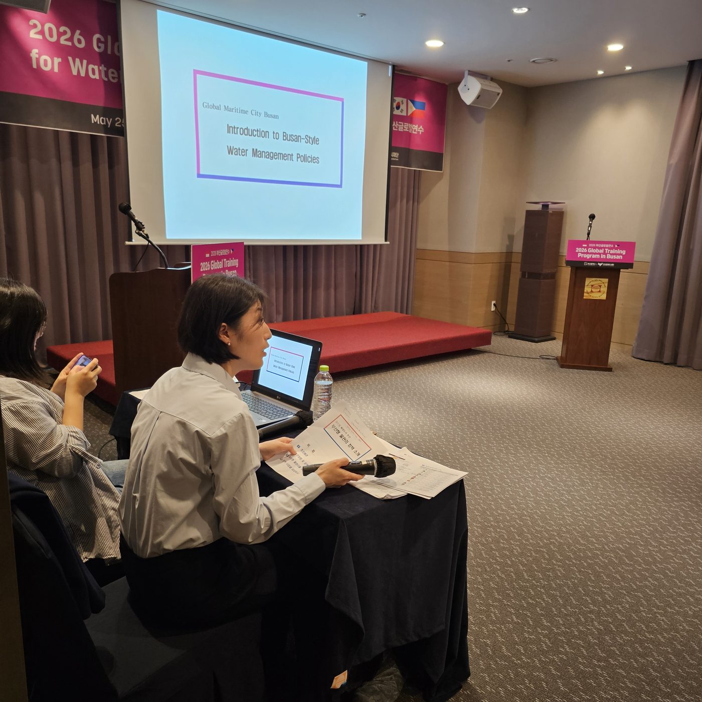 Interpreting a presentation at a Busan global training program